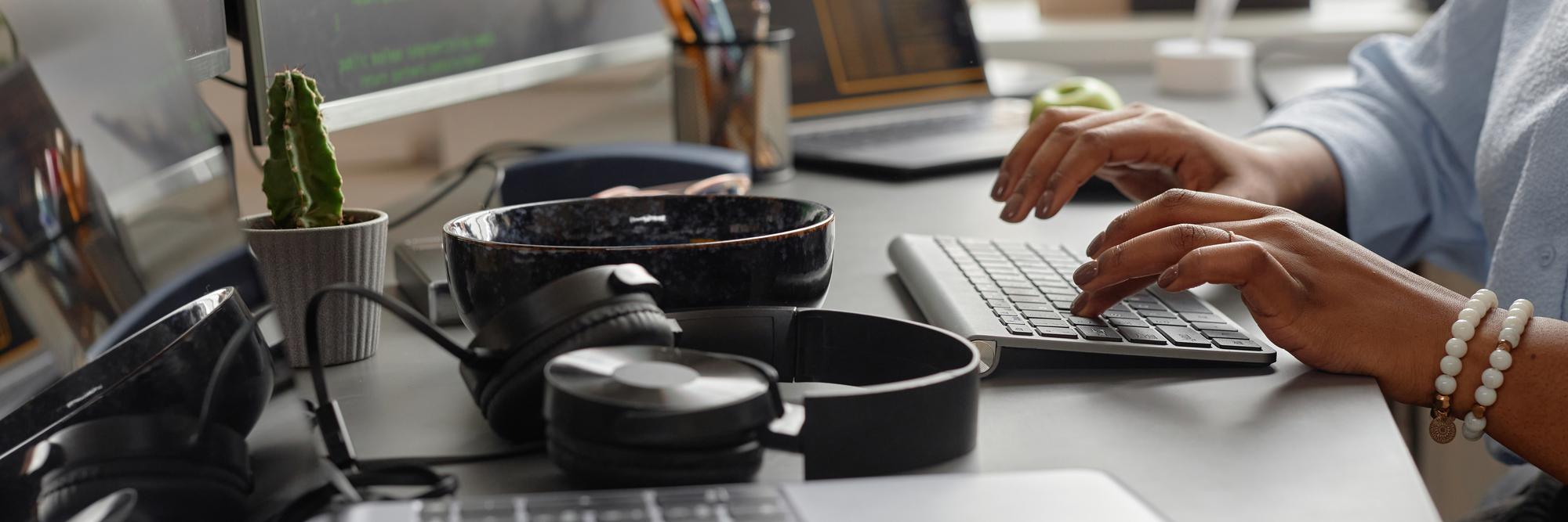 Modern test kitchen workspace with utensils and laptop